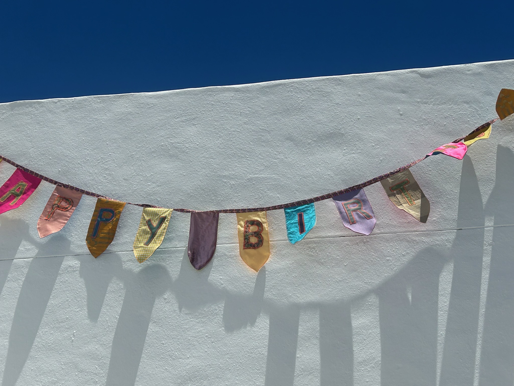 Long wall of birthday flags